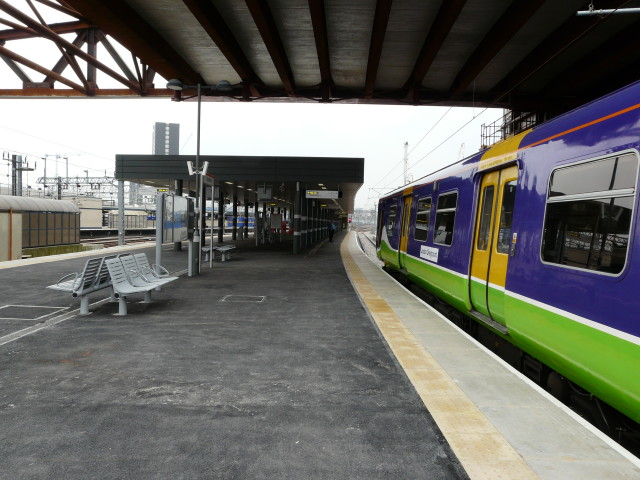 Platform view with the new Olympic Bridge in construction overhead