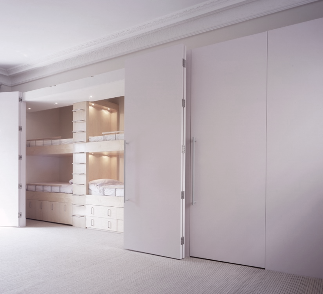Hidden Bedroom!
Behind a set of flush folding doors a beautifully crafted sleeping and storage furniture arrangement has been installed